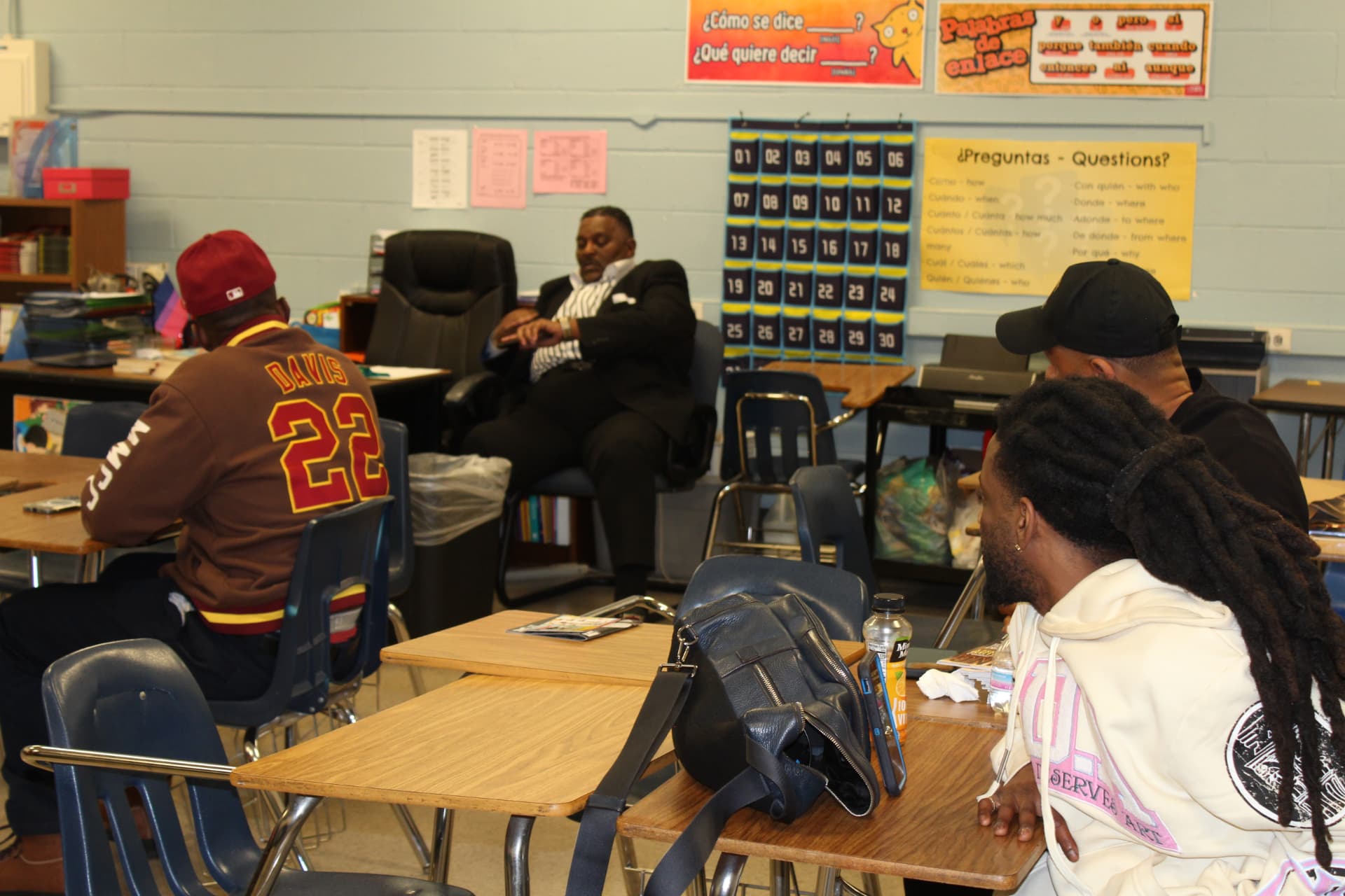 A facilitator leading a small-group discussion